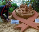Sand sculpture created depicting communities role in curbing HIV+ on World Aids Day